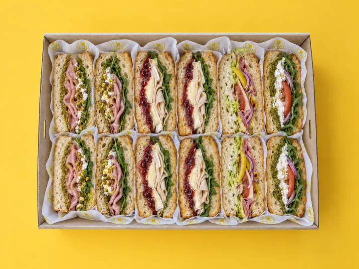 The Deli Box from above: six focaccia sandwiches cut in half in a Kanteen catering box