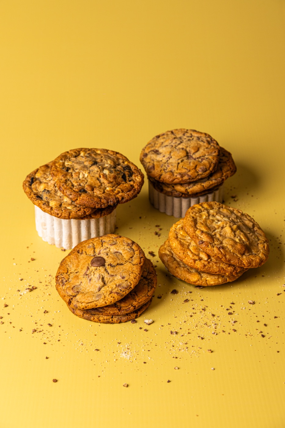 Chocolate chip cookies stacked on little ramekins