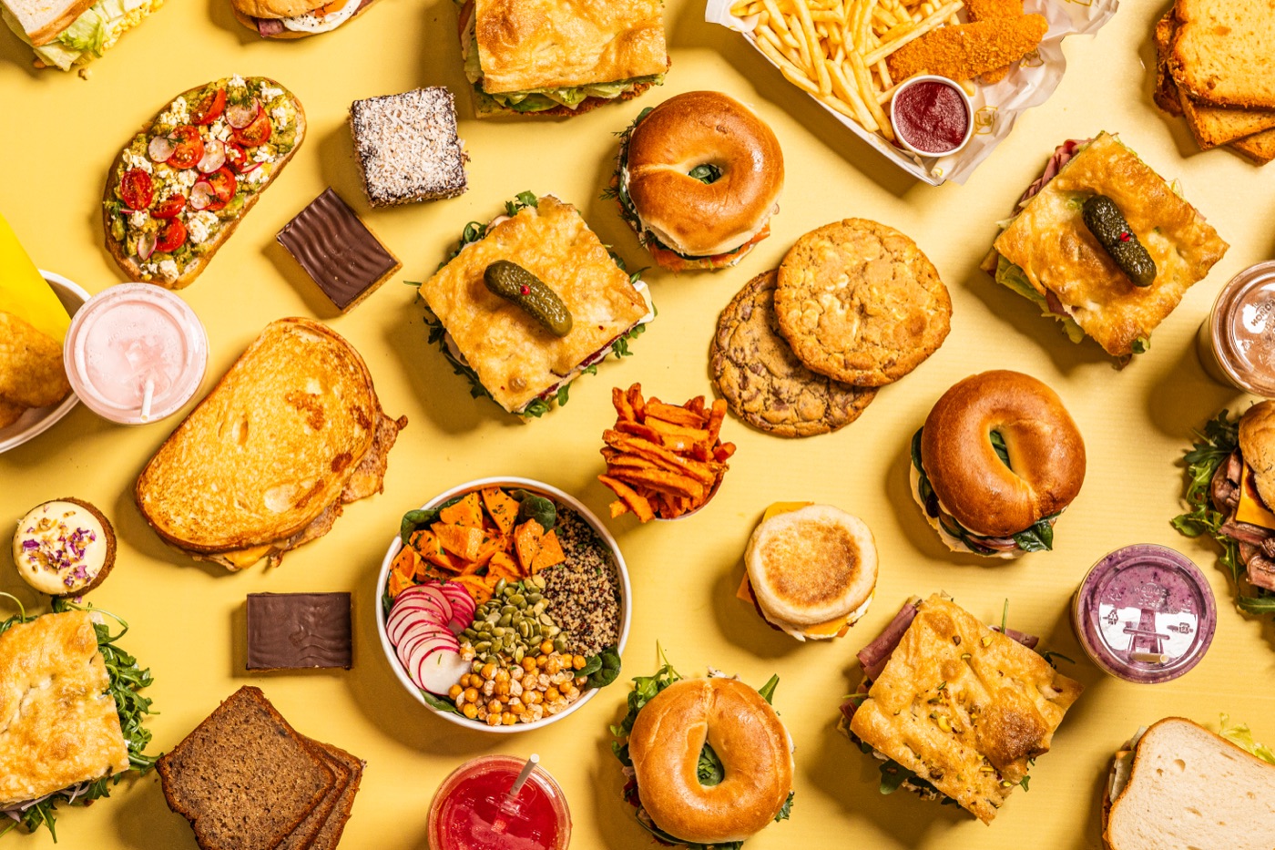 A spread of Kanteen food on a yellow table